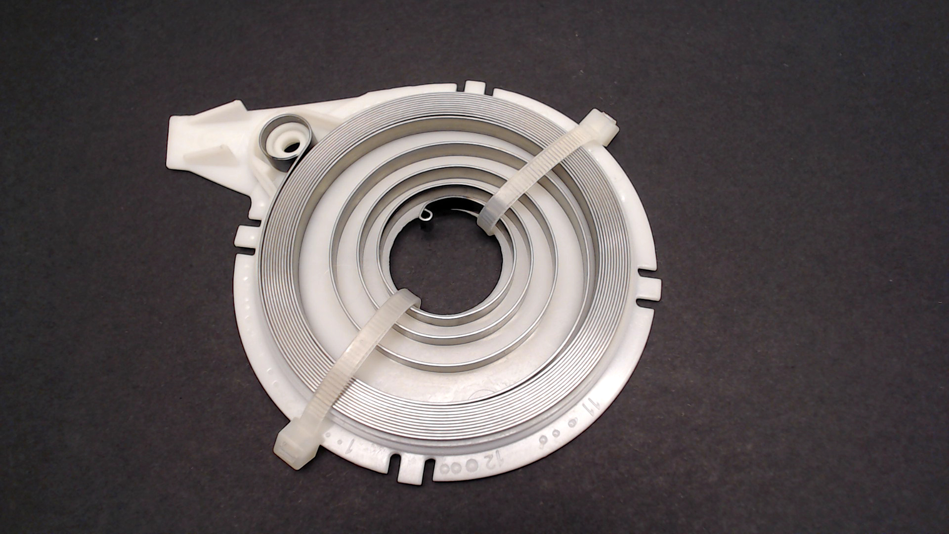 Makita 394163020 REWIND SPRING IN HOUSING DPC